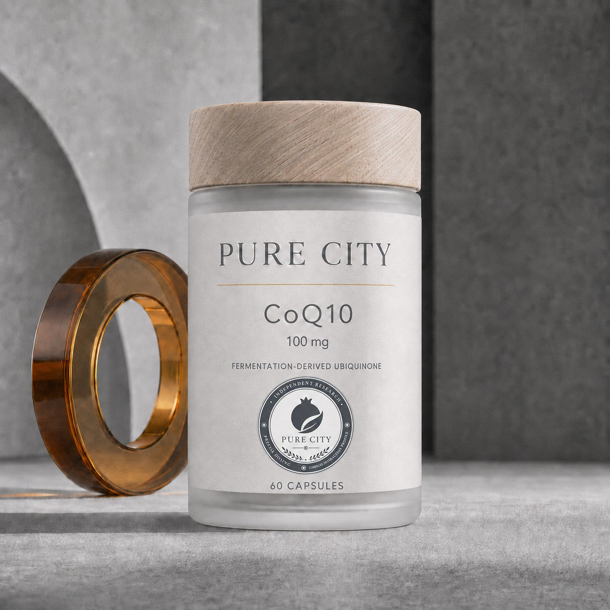 Pure City CoQ10 100 mg — frosted glass jar with wooden cap, 60 fermentation-derived ubiquinone capsules